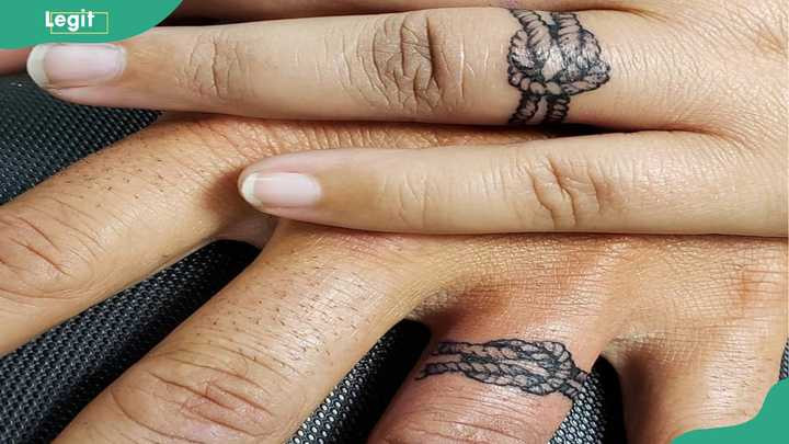 Tie the knot tattoo for couples playfully representing marriage commitment.