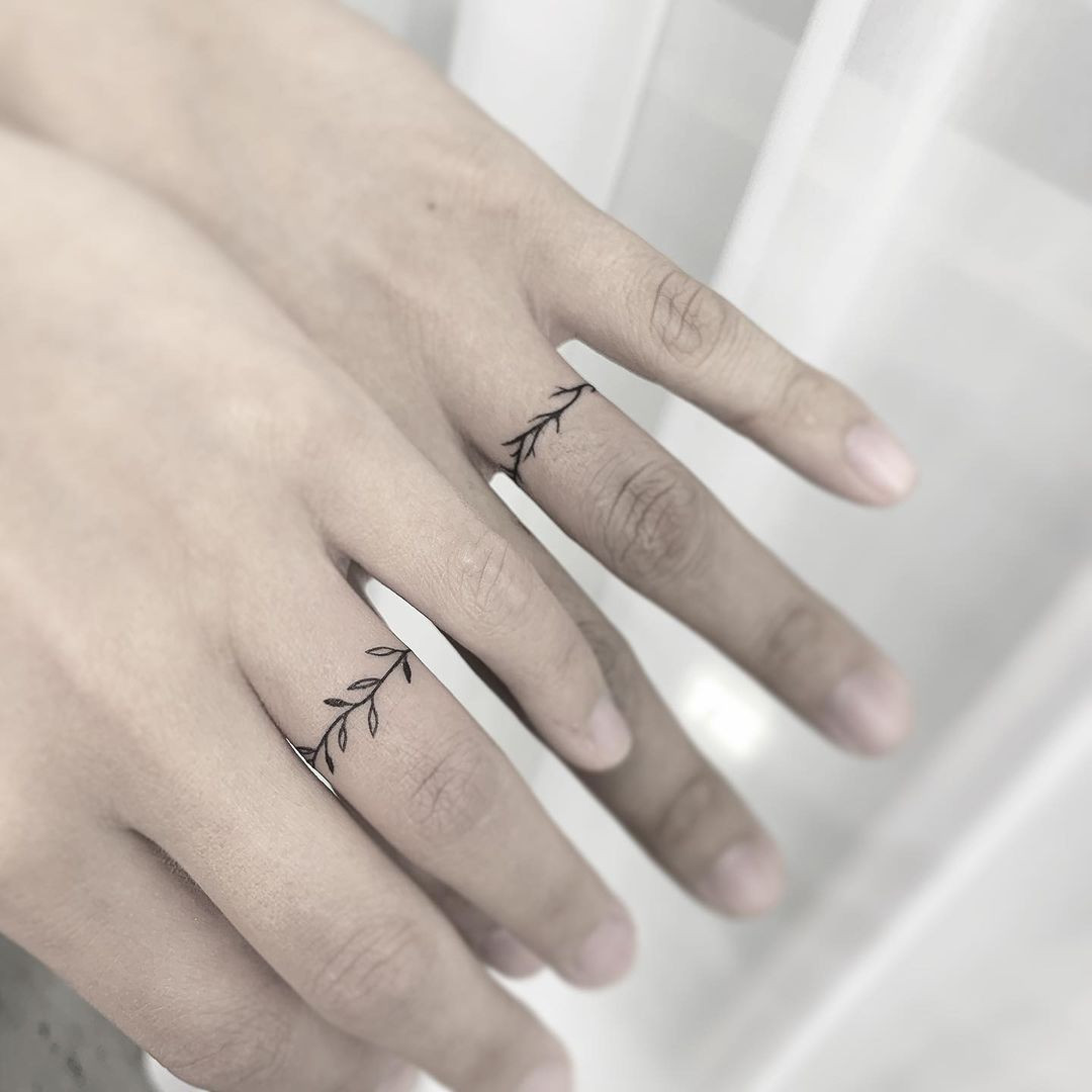 Vine ring tattoo with leafy details