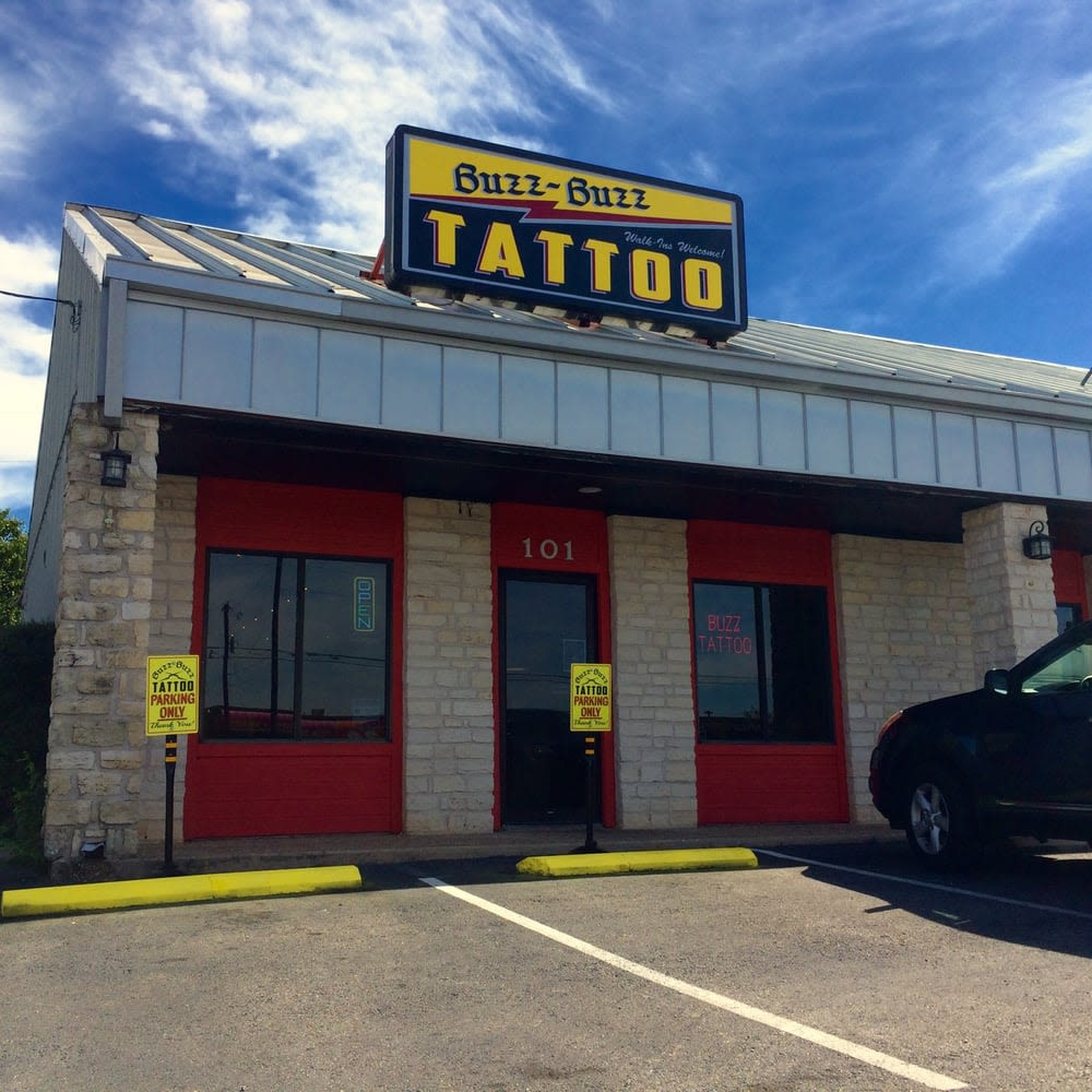 Buzz Buzz Tattoo shop in Austin, showcasing traditional tattoo designs and shop decor.