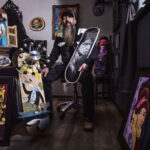 Artist Aaron Moore tattooing at West Side Tattoo shop in Colorado Springs
