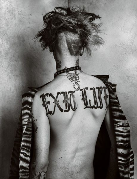 Lil Peep's back of neck and back tattoos featuring a scorpion and &quot;Exit Life&quot;.