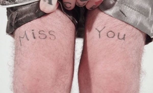 Lil Peep's thigh tattoos spelling &quot;Miss You&quot;.