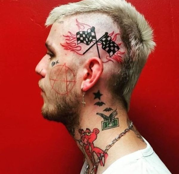 Lil Peep's side of neck tattoos featuring a star, bats, and flying bats.