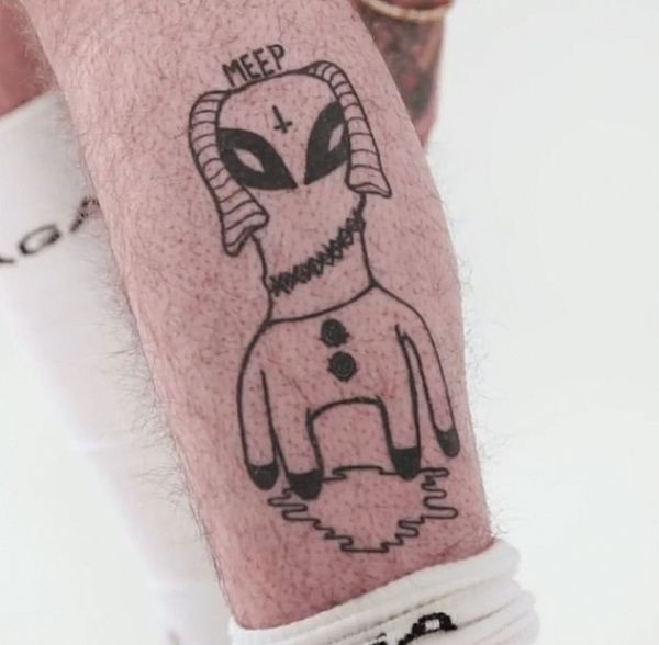 Lil Peep's leg tattoo featuring a &quot;Meep&quot; alien.