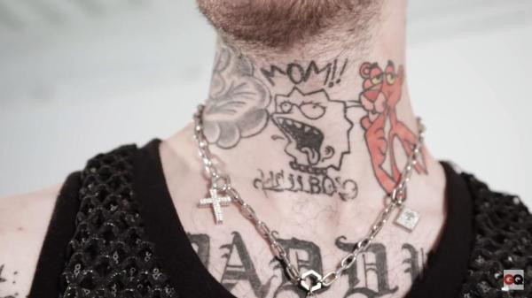 Tattoos on Lil Peep's throat and chest including &quot;Mom!!&quot;, Lisa Simpson, &quot;Hellboy&quot;, Pink Panther, and &quot;Daddy&quot;.