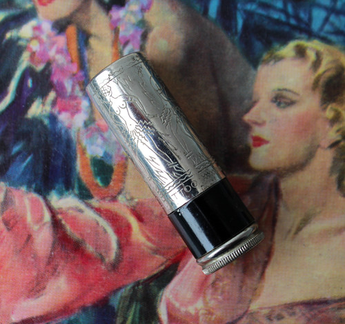 Another view of a Tattoo lipstick, highlighting the packaging details and vintage aesthetic