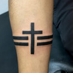 Tribal armband tattoo with geometric patterns.