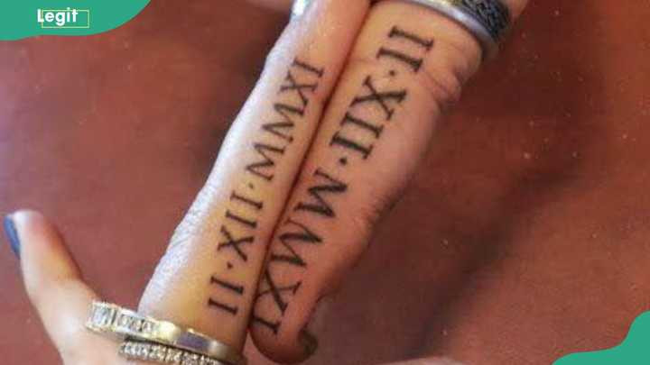 Roman numerals tattoo elegantly marking significant dates like anniversaries.