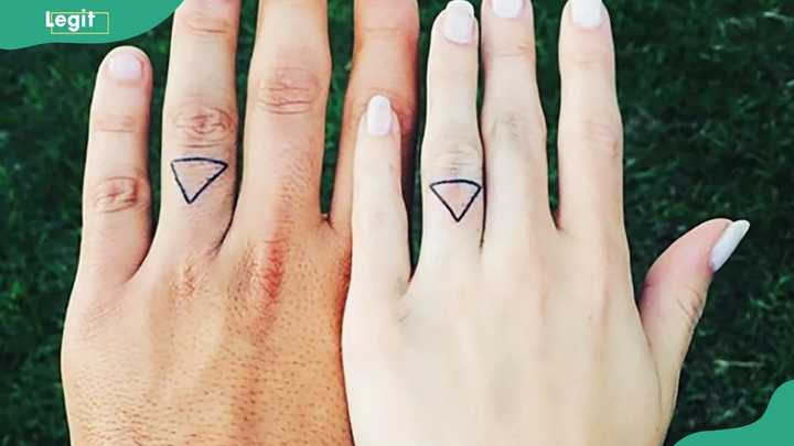 Diamond wedding ring tattoo symbolizing eternal love and enduring commitment.