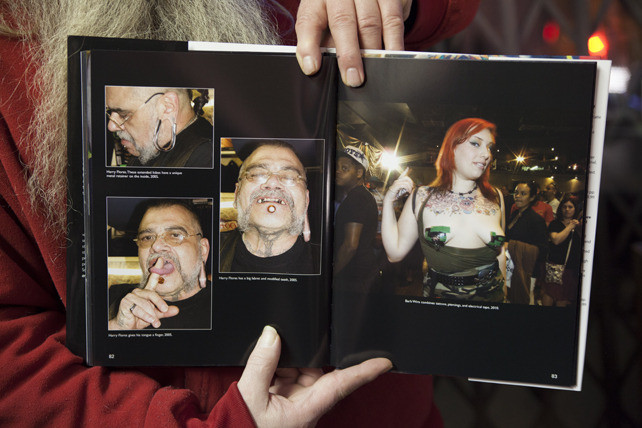 Huggy Bear, a personality within the New York tattoo scene, adding to its unique character.