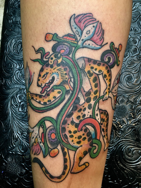 Realistic color tattoo of a cheetah by Kevin Craig