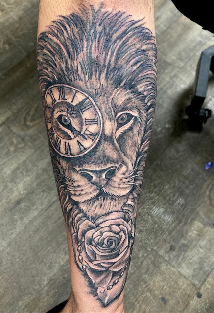 Majestic black and gray tattoo of a lion portrait by Kevin Craig