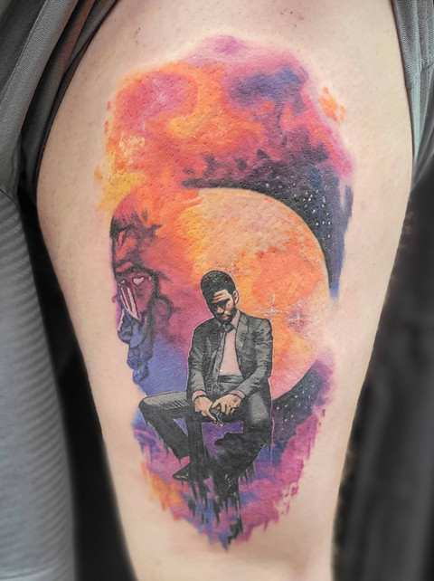 Black and gray portrait tattoo of Kid Cudi by Jenna Totten