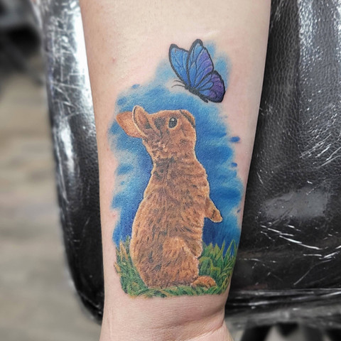 Cute and whimsical color tattoo of a rabbit character by Jenna Totten