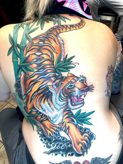 Powerful black and gray tattoo of a roaring tiger by Kevin Craig