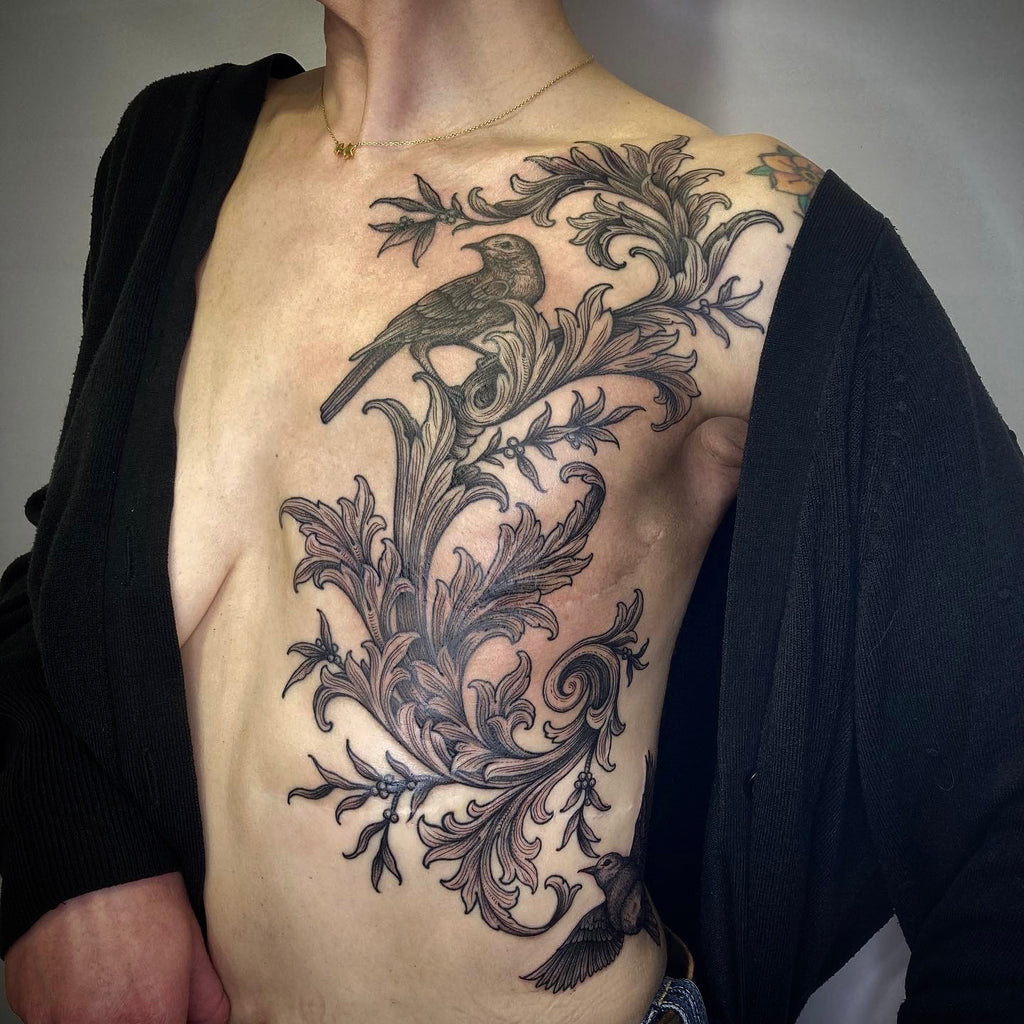 Detailed view of an engraving tattoo by Lacey Law, emphasizing line work and shading techniques