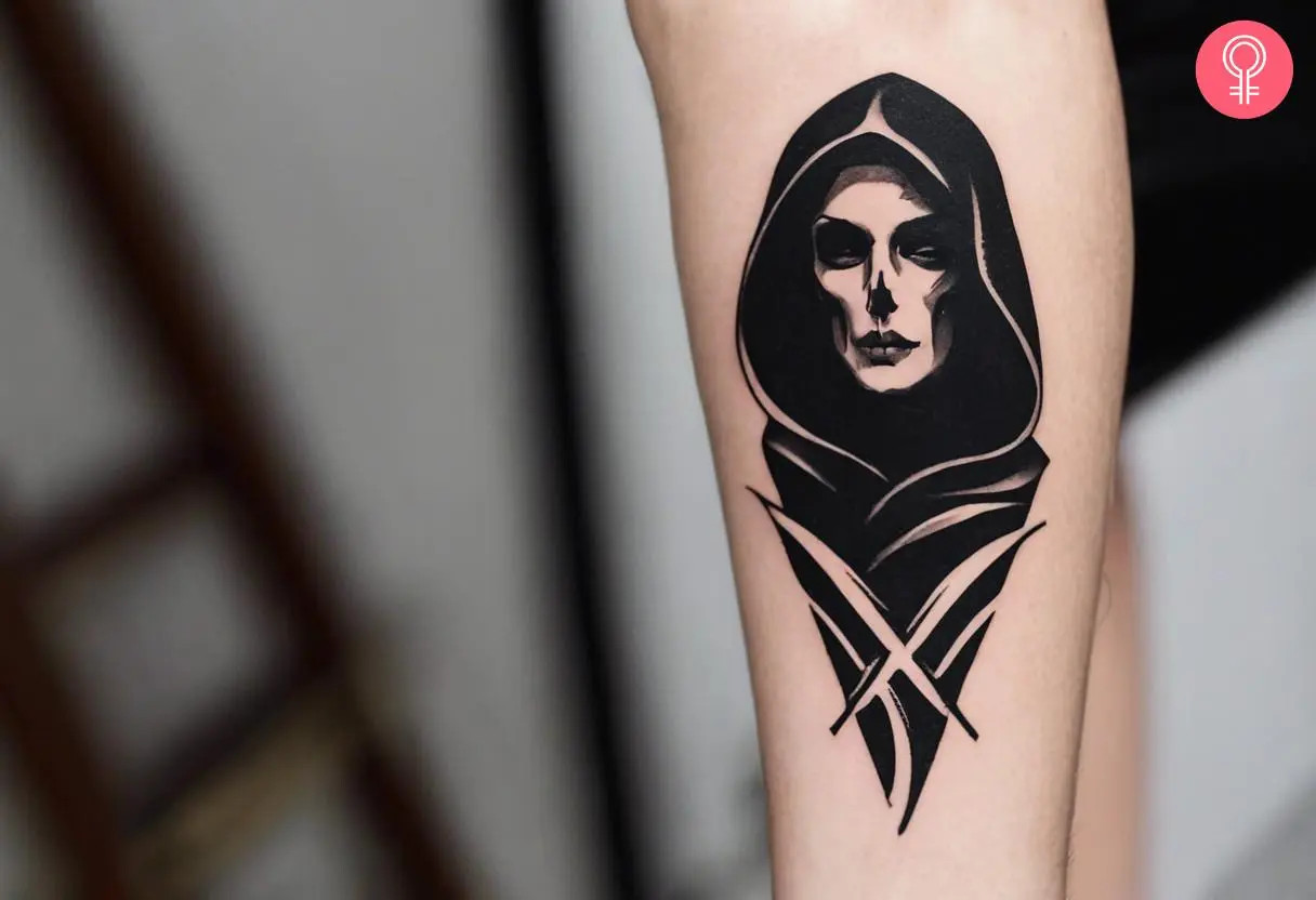 Grim Reaper face tattoo on a woman's forearm, rendered in black ink, featuring a bust of a female reaper with skeletal and human features, and bold lines and shading, representing classic tattoo aesthetics and stoicism.