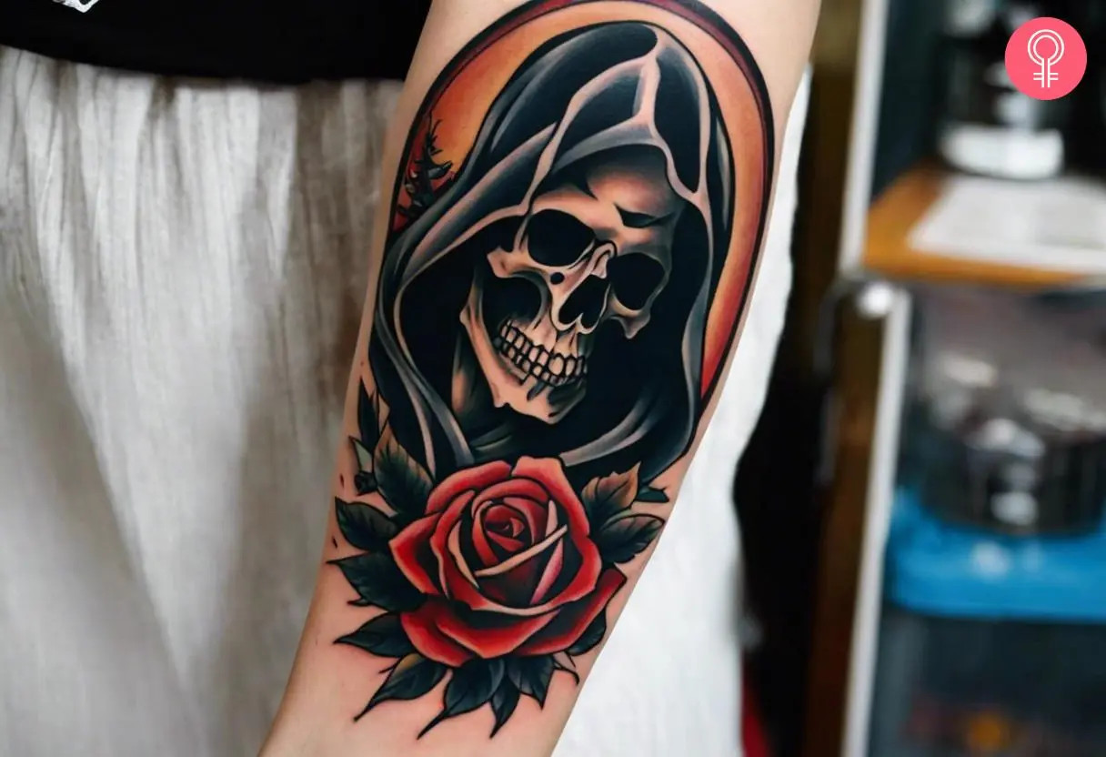 Grim Reaper skull tattoo on a woman's forearm, blending a hooded reaper skull with a blooming rose, representing the contrast between darkness and beauty, and the acceptance of mortality.