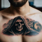 Grim Reaper tattoo on a man's chest, featuring a skeletal figure against a cloudy background with a crescent moon and a lone tree, symbolizing mortality and solitude.