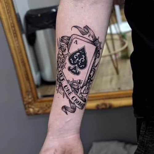 Ace of spades tattoo on the hand, symbolizing power in men tattoo ideas.