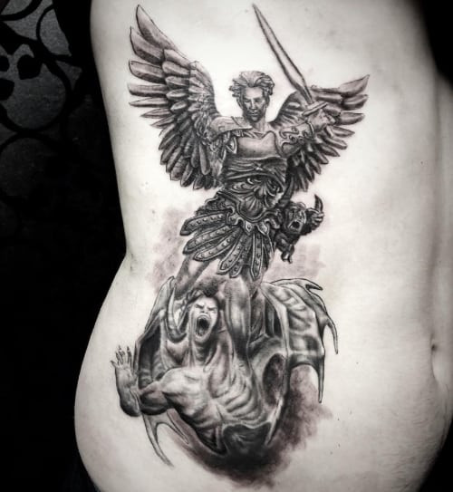 Dynamic angel fighting demons tattoo, representing spiritual warfare and the triumph of good over evil.