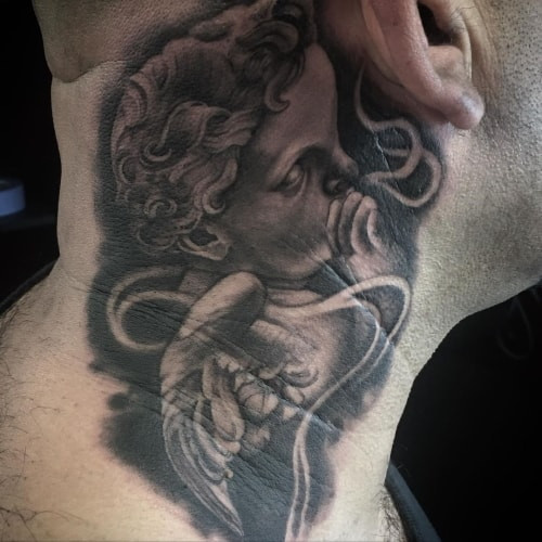 Subtle angel whispering in ear tattoo, symbolizing seeking guidance and divine communication.