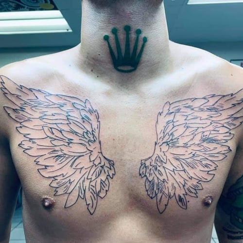 Expansive angel wings chest tattoo, offering a large canvas for dramatic wing designs that can be concealed.