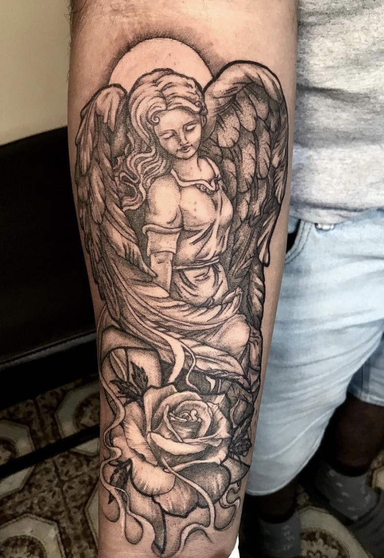 Elegant rose and angel tattoo, combining beauty, love, and spiritual grace in a harmonious design.