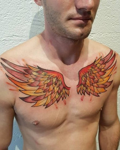 Man with an angel chest tattoo featuring a detailed angel with wings spread across his chest