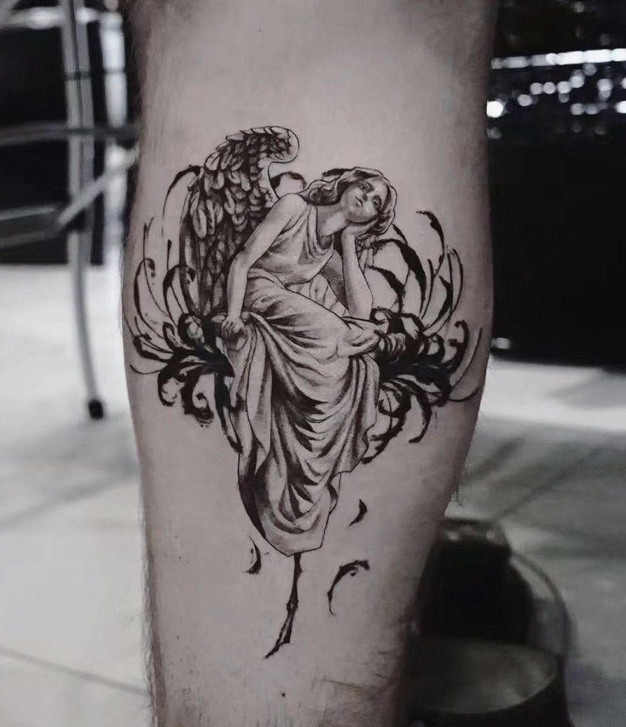 Unique angel leg tattoo, offering a distinctive placement for larger and more detailed designs on the calf or thigh.