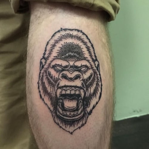 Minimalist line art animal tattoos on a man's forearm