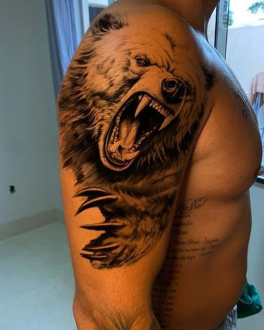 Animal sleeve tattoo featuring a wolf, bear, and eagle in a realistic style