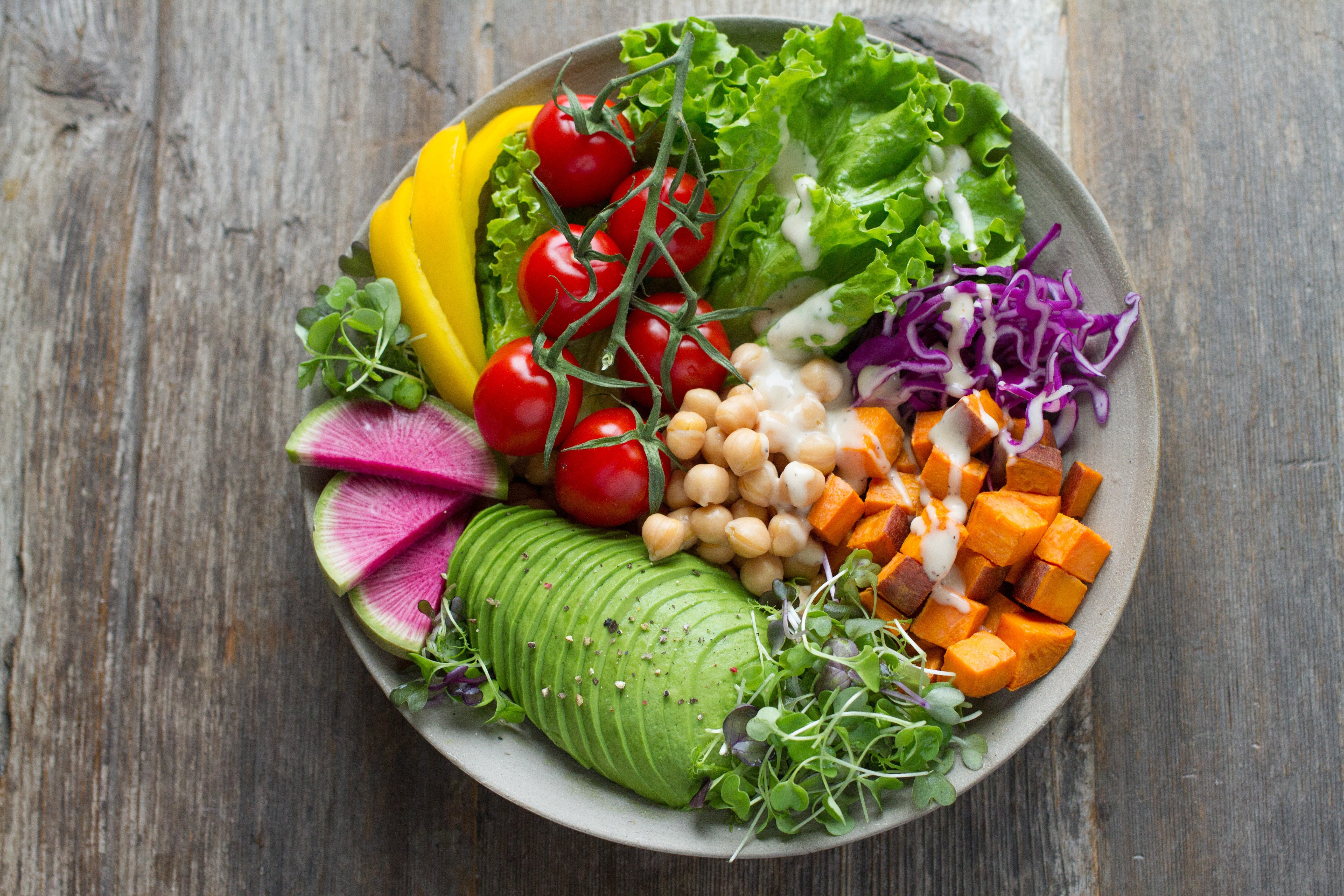 A person enjoying a healthy and balanced meal, emphasizing the importance of nutrition before a tattoo.