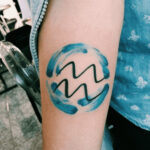 Aquarius symbol and water flow tattoo