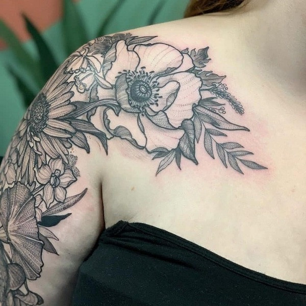 Minimalist line art aster flower tattoo, a single continuous line forming the flower shape, on the collarbone.