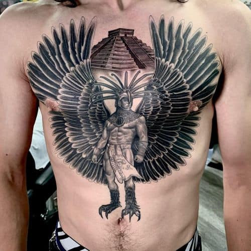 Two aztec tattoos on men, one on the chest with a stylized Aztec serpent and another on the shoulder with a geometric Aztec pattern.