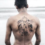 Men's back tattoo showcasing intricate design and placement