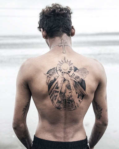 Intricate full back tattoo for men featuring detailed linework and shading, showcasing a powerful artistic statement.