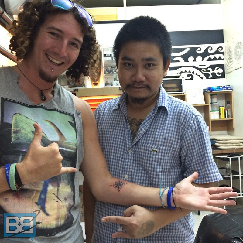 Man showing off his new bamboo tattoo