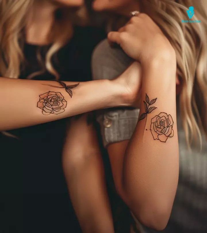 Mother and daughter with matching shoulder tattoos