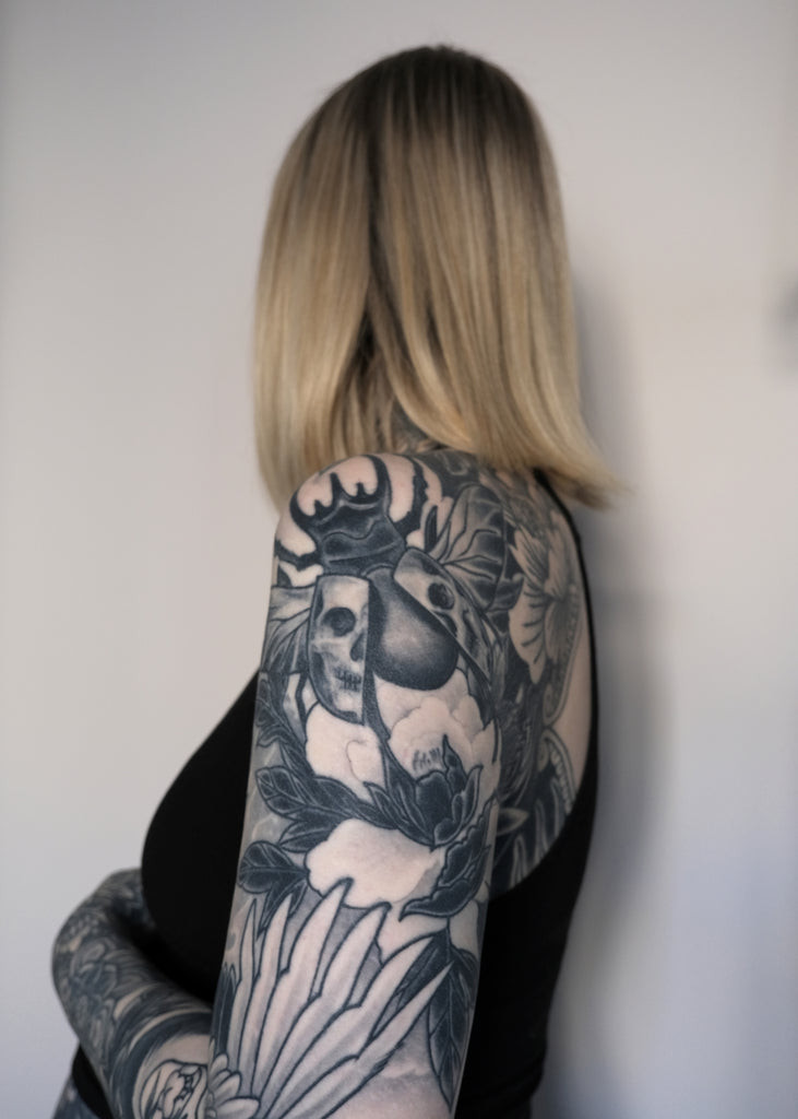 Upper arm tattoos