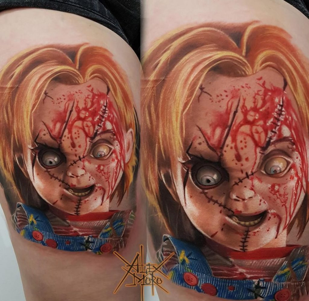 Detailed realistic Annabelle doll tattoo in black and grey by Aleksandr Morozov.