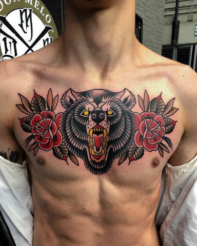 Bear chest tattoo covering the chest, symbolizing strength, courage, and power.