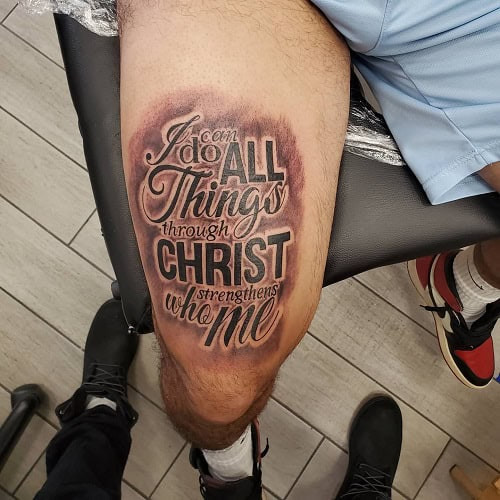 Forearm tattoo with bible verse in elegant script