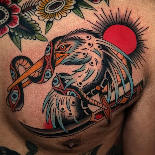 Prominent bird chest tattoo for men, a bold statement piece with personal significance