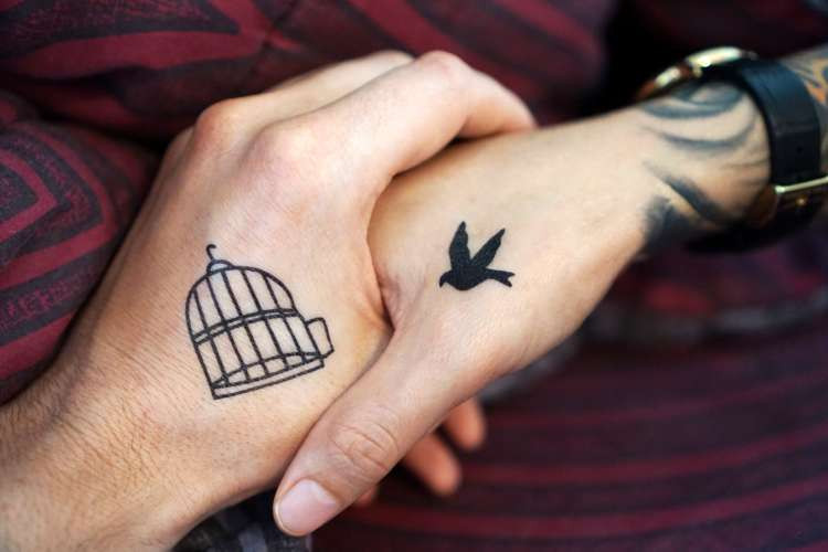 bird and cage couples tattoo