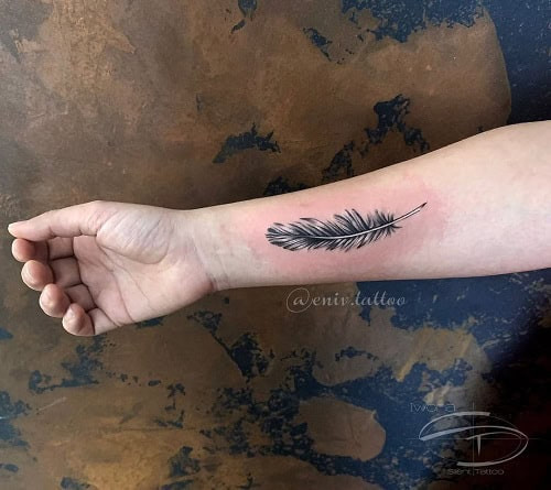 Elegant bird feather tattoo for men, representing freedom, bravery, and a light spirit