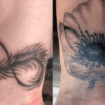 Black and grey infinity symbol tattoo cover up, transforming a feather into a floral design.