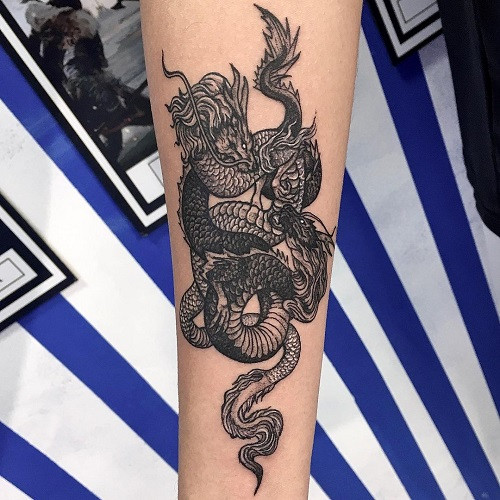 Solid black ink blackwork dragon tattoo