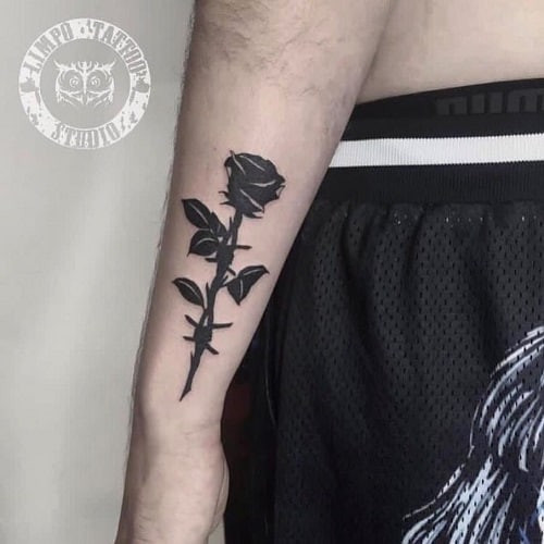 Black Rose Forearm Tattoo with Delicate Petal Detail